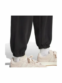 Urheiluhousut & Treenitrikoot<adidas Originals Fleece Loose -joggerit IY9637 BLACK