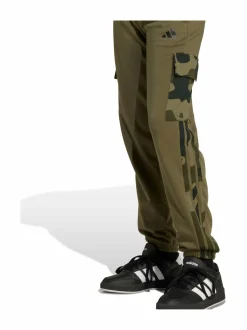 Housut|Housut & Jumpsuitit<adidas Sportswear Junior Camo 3 Stripes -reisitaskuhousut JN2218 OLISTR/BLACK